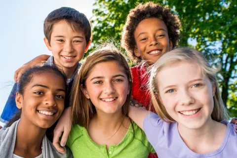 Group of 5 smiling tweens