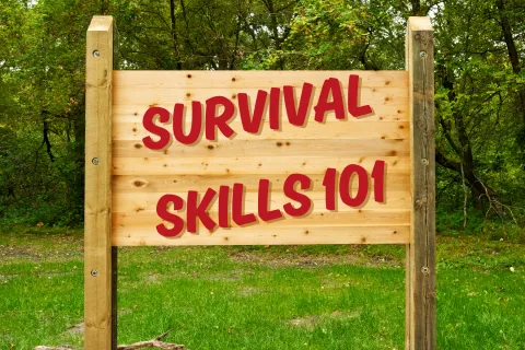 Wooden sign with letters spelling Survival Skills 101