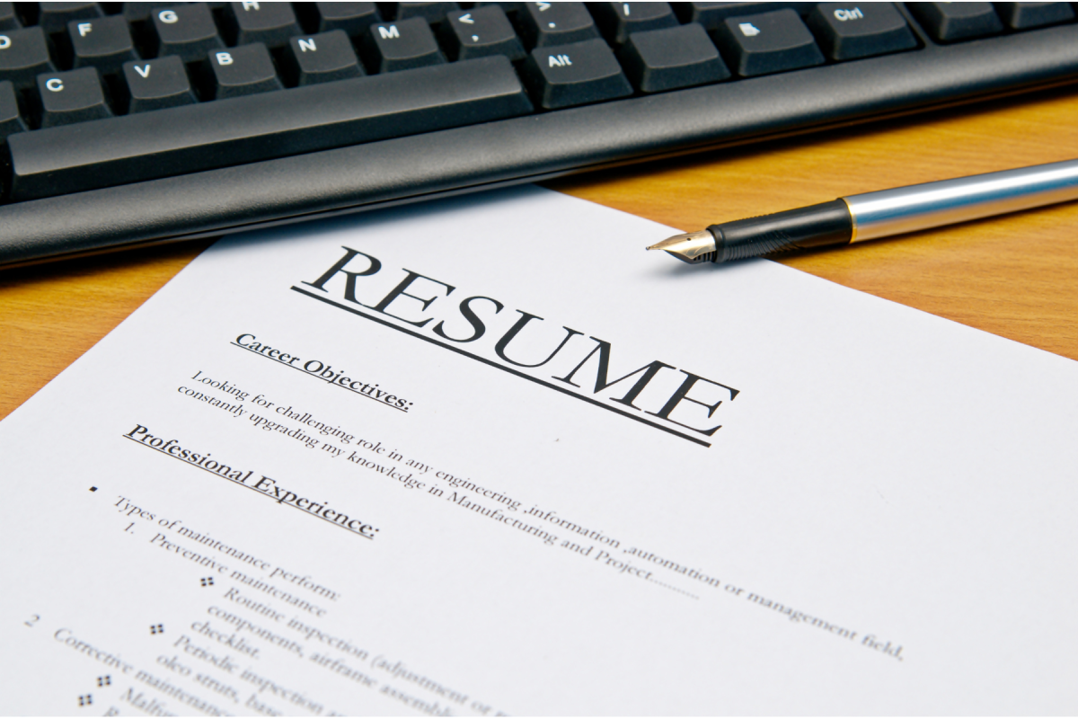 Photo of computer keyboard, pen, and Resume