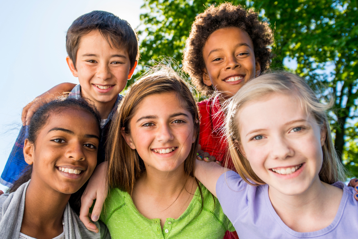 Group of 5 smiling tweens